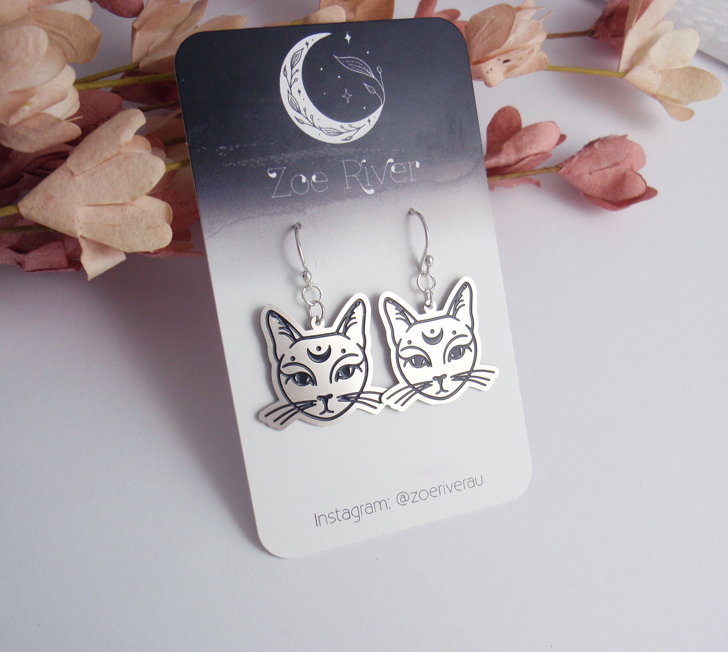 Silver cat crescent moon earrings. Your choice of 925 sterling silver, nickel free titanium or stainless steel, dainty crescent moon cosmic cat earrings