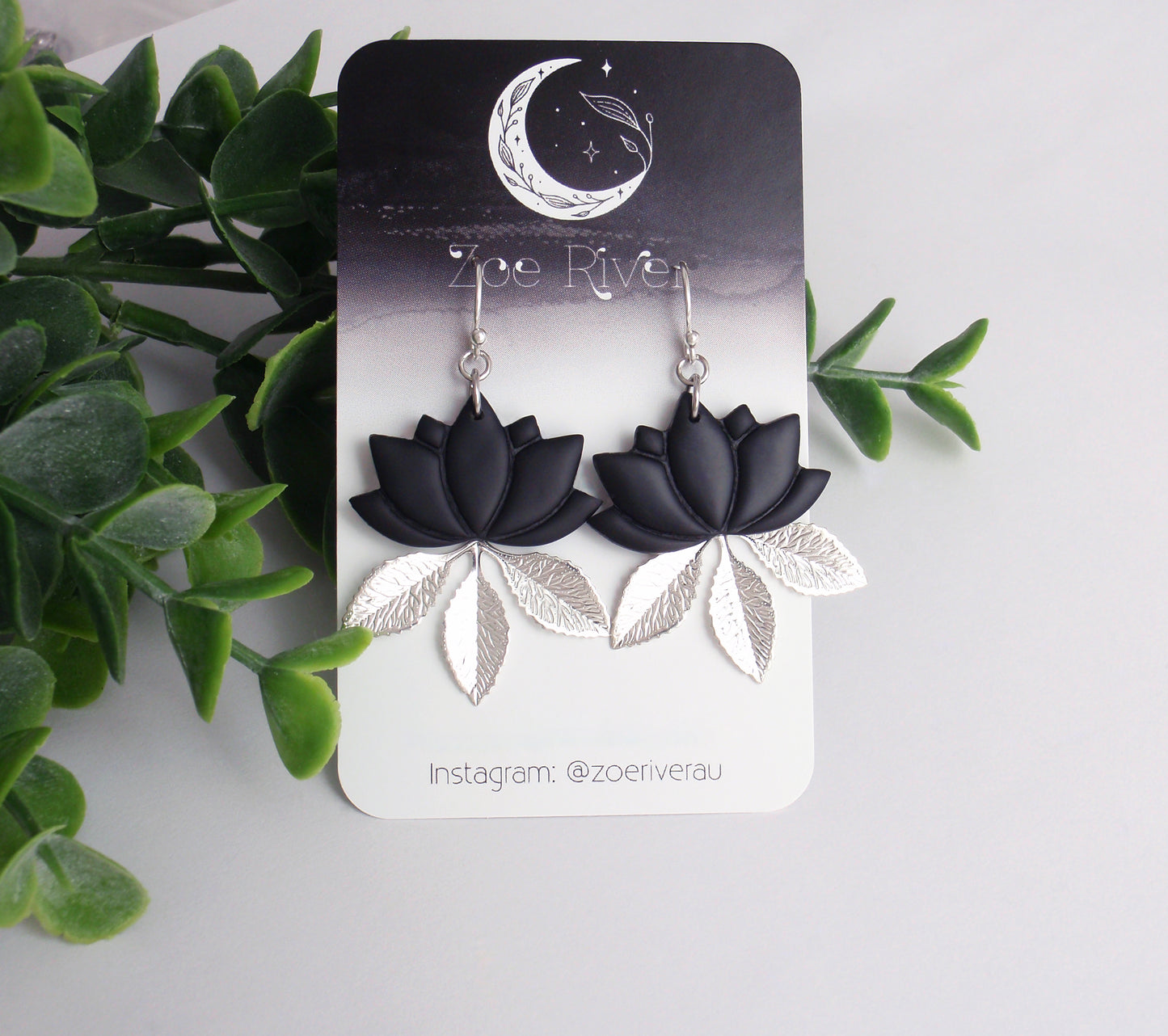 Lightweight black lotus, silver leaf branch earrings. Your choice of 925 sterling silver, nickel-free titanium or stainless steel earwires. Zen, om, lightweight statement earrings