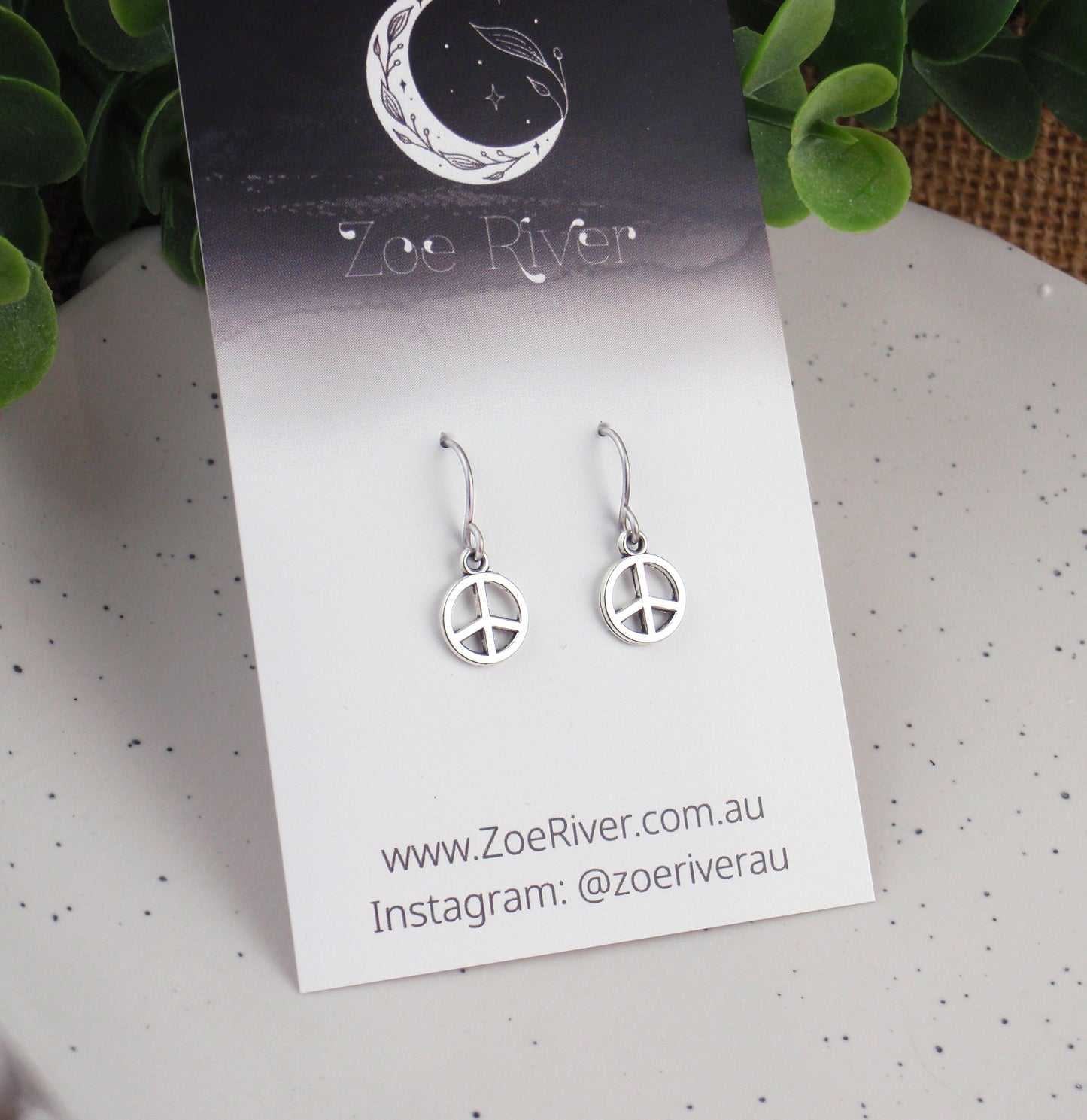 Tiny silver peace sign earrings. Choose from Stainless steel, nickel free titanium or 925 sterling silver earwires. Small peace sign earrings