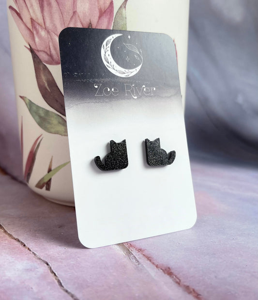 Cat earrings with your choice of 925 sterling silver, stainless steel or titanium earposts. Glitter black dainty small cat stud earrings.